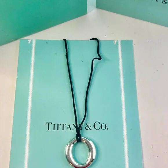 Tiffany & Co. Elsa Peretti Sevillana pre-own silver pendant with silk black cord